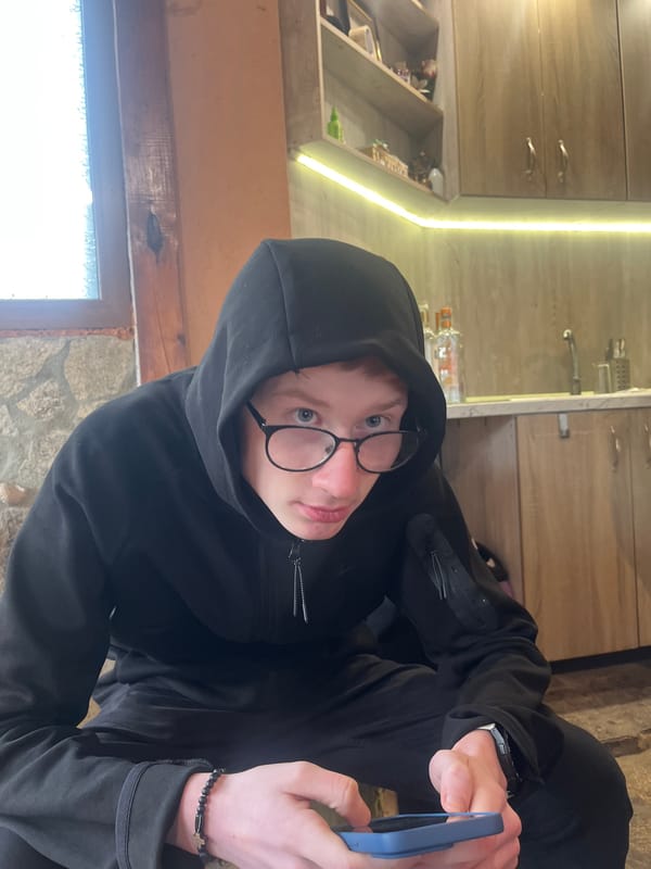 Person with phone captured indoors in Bulgarian residence