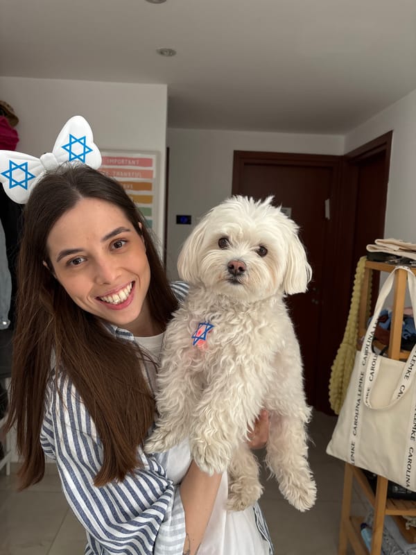 Woman with dog wear Star of David accessories in Bat Yam