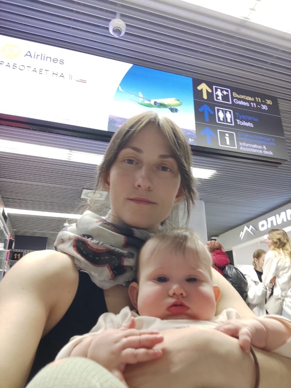 Family with baby travels through Sochi Airport early morning