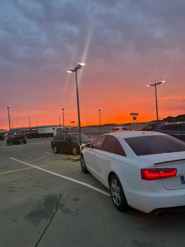Striking summer sunset over a Prague retail parking lot
