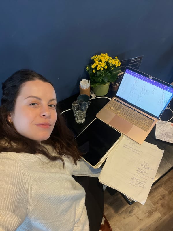 Woman documents morning workspace routine in Meisenheim, Germany