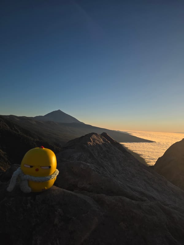 Mountain sunrise viewing with toy mascot in La Orotava