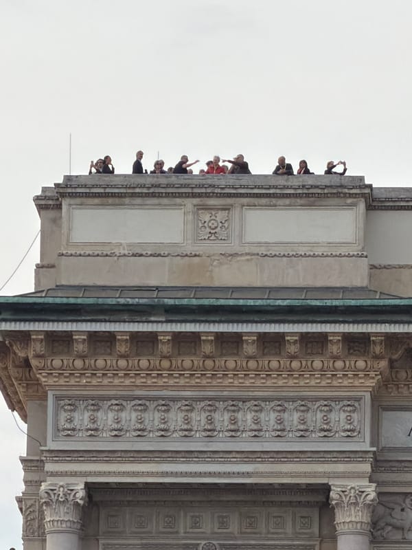 Tourist documents Milan's historic architecture during afternoon visit