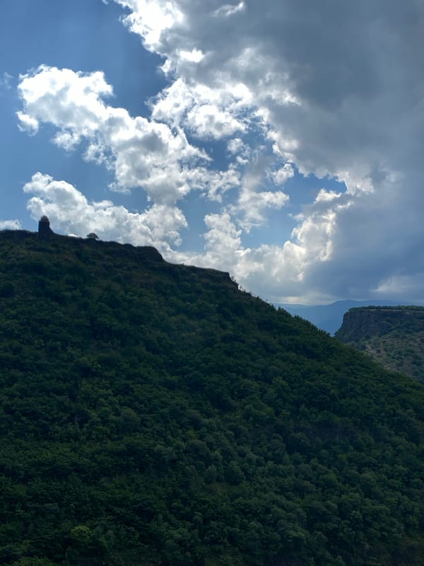 Food, wine, and mountain views at a Haghpat guesthouse