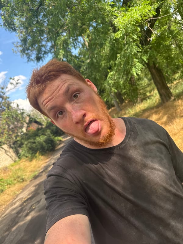 Outdoor selfie session on a gravel road with tattoos and greenery