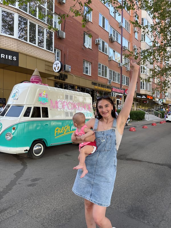 Street vendors serve customers with baby in Krasnodar
