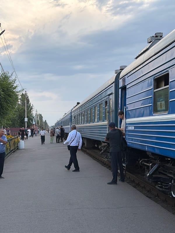 Train activity and crowds at Kant station, Kyrgyzstan
