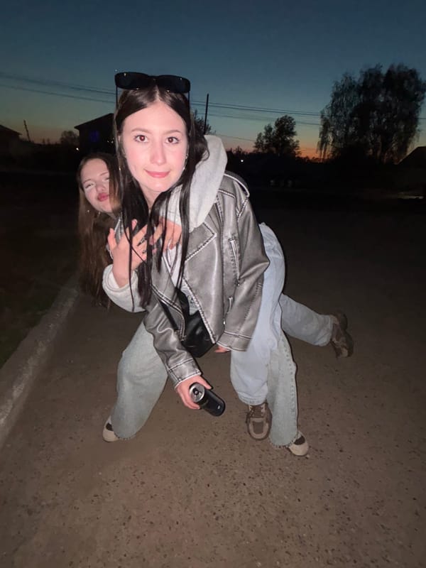 Two women document twilight photo session in Фоки, Russia