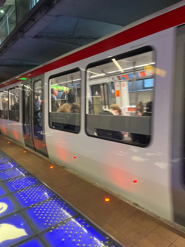 Lyon Metro train observed at station with passengers visible
