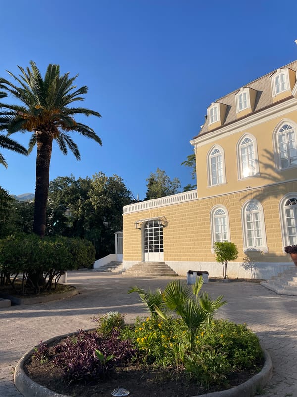 Villa Bar's historic yellow facade up close in Montenegro