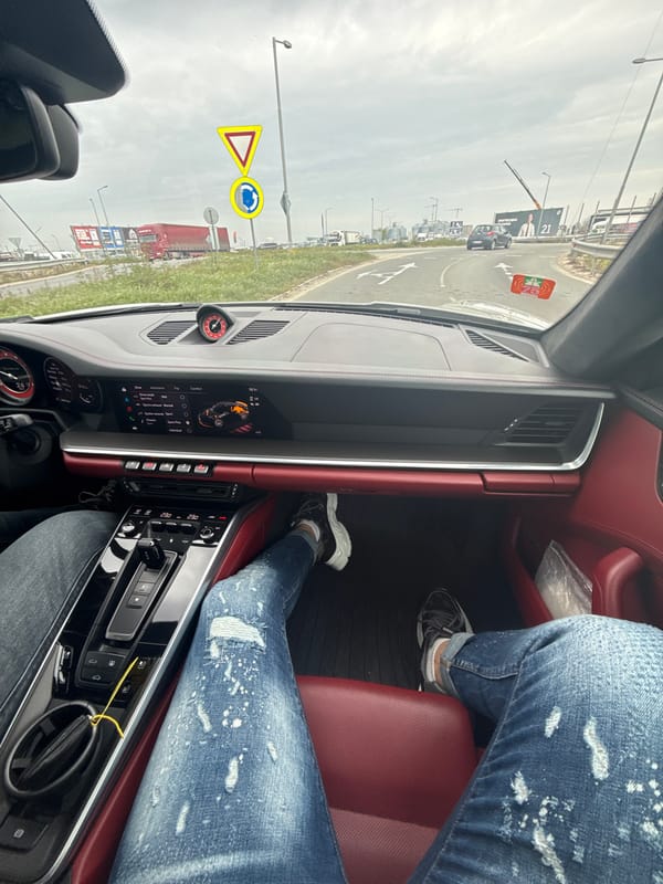 Two people photographed inside Porsche in Trud, Bulgaria
