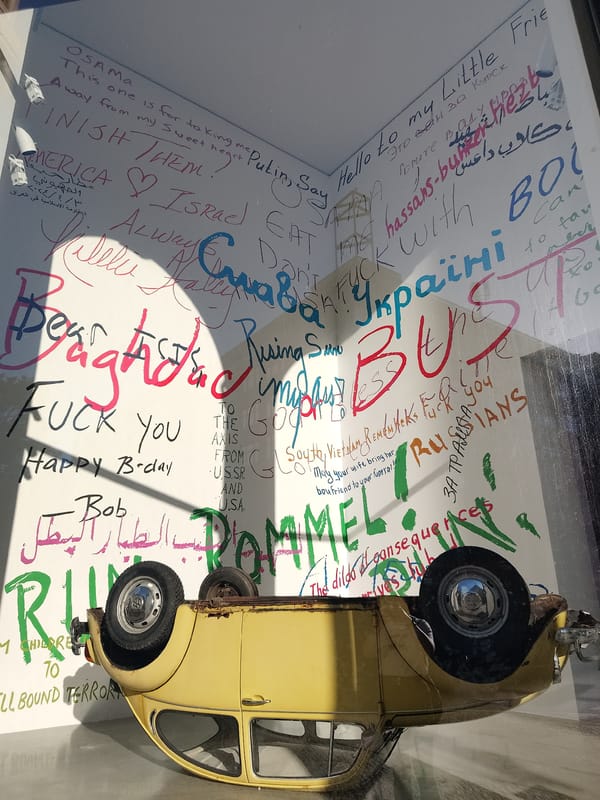 Public art installations documented: painted bear statue, overturned Beetle display