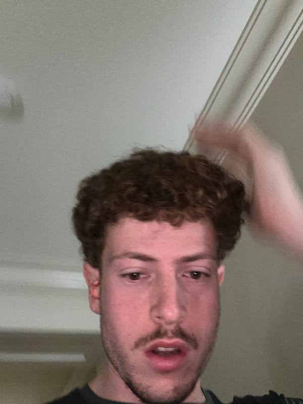 Man with curly hair observed in Aventura, Florida