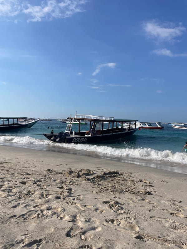 Lazy beach morning at Gili Trawangan, boats anchored offshore