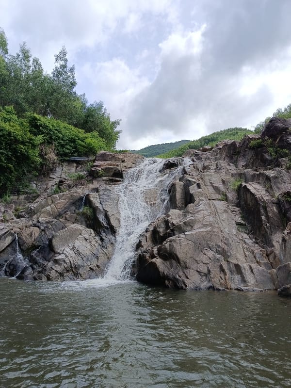 Rocky waterfall and jungle hills near Đà Nẵng