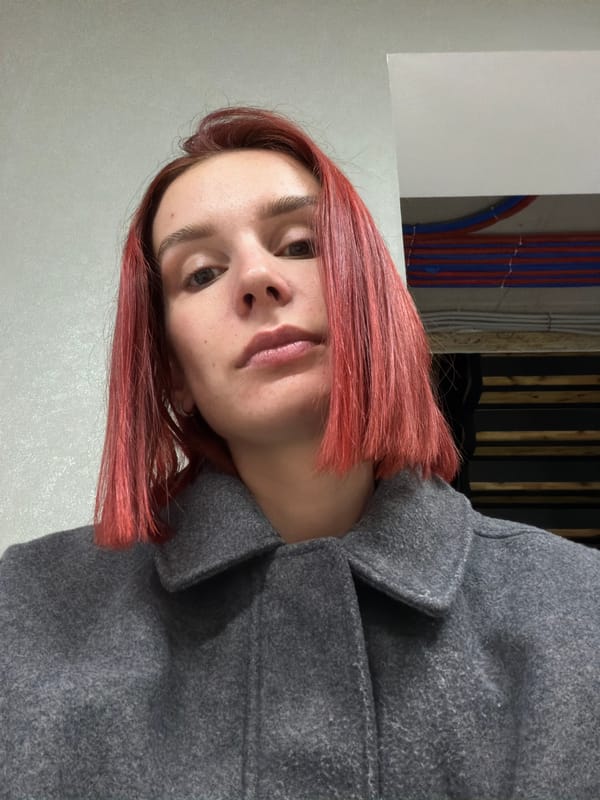 Woman photographed in modern kitchen during casual moment
