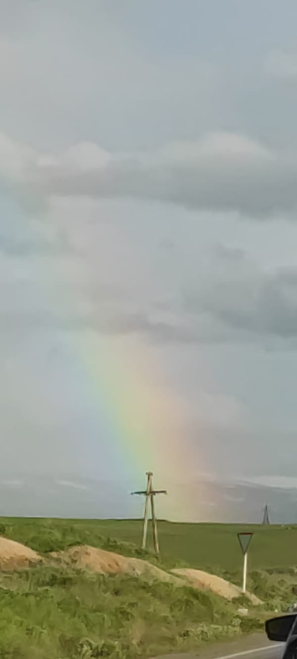 Partial rainbow spotted over rural Azatan, Armenia countryside