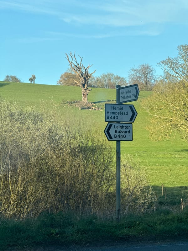 Rural signpost observed in Dacorum showing local directions