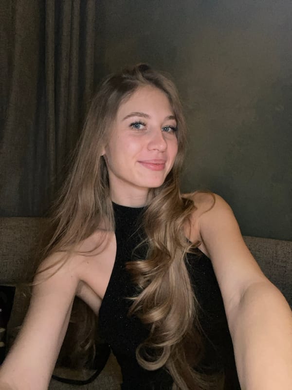 Woman celebrates birthday with dessert in Moscow apartment