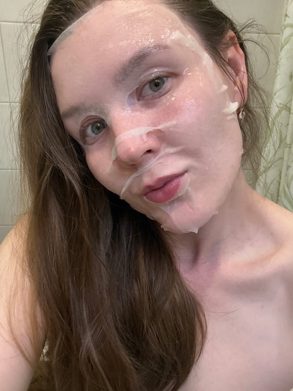 Woman documents skincare routine with facial mask in Izhevsk