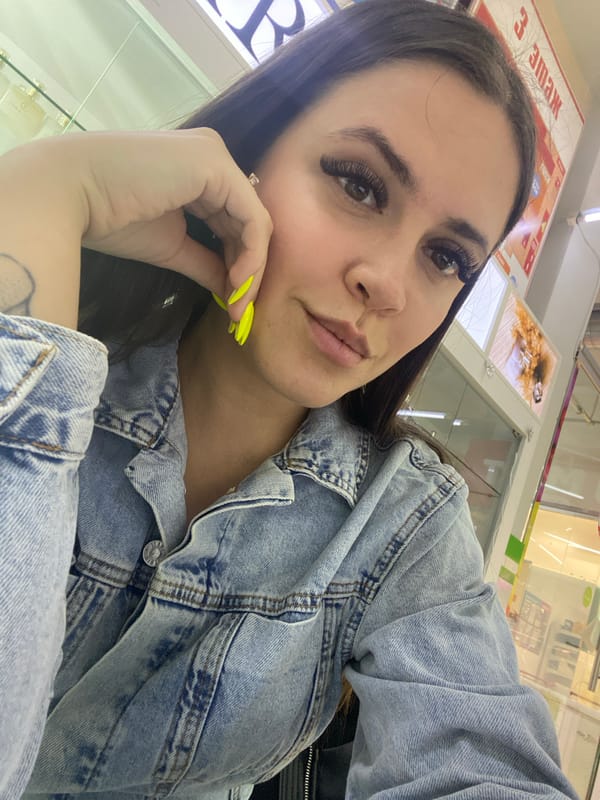 Woman takes selfies while shopping in Chaikovsky, Russia