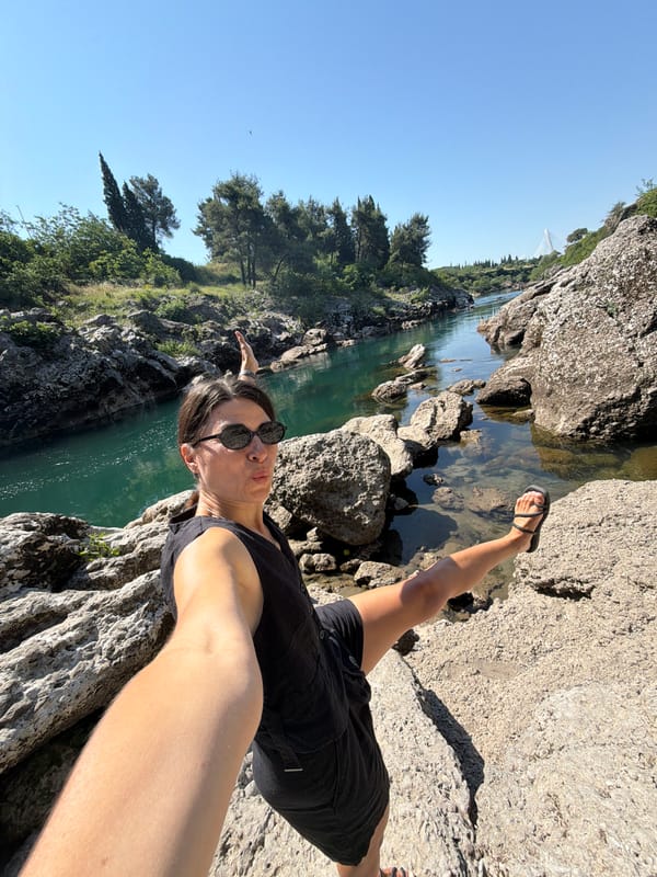 Woman photographs morning river visit in Podgorica Montenegro