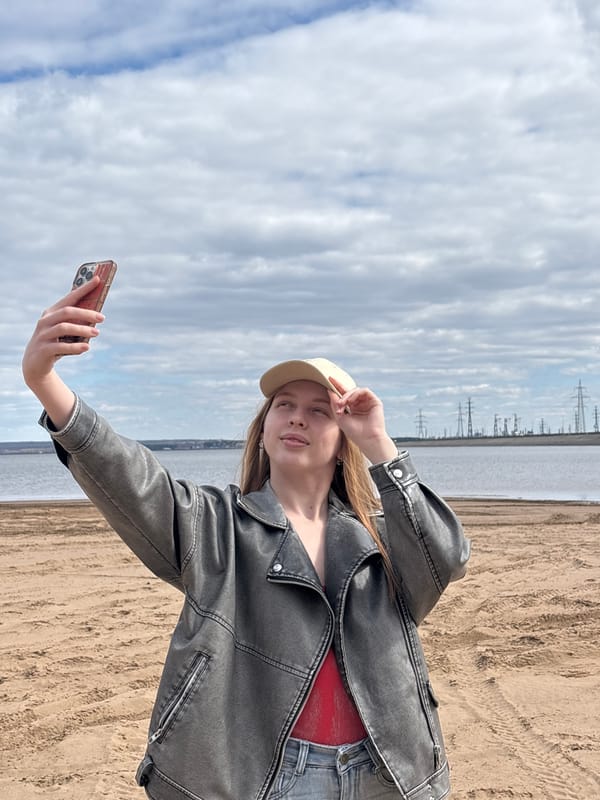 Young people gather for beach photos and socializing in Noviy