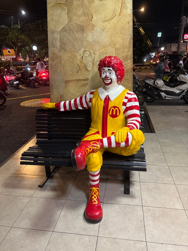 Ronald McDonald statue spotted on bench in Kuta Selatan