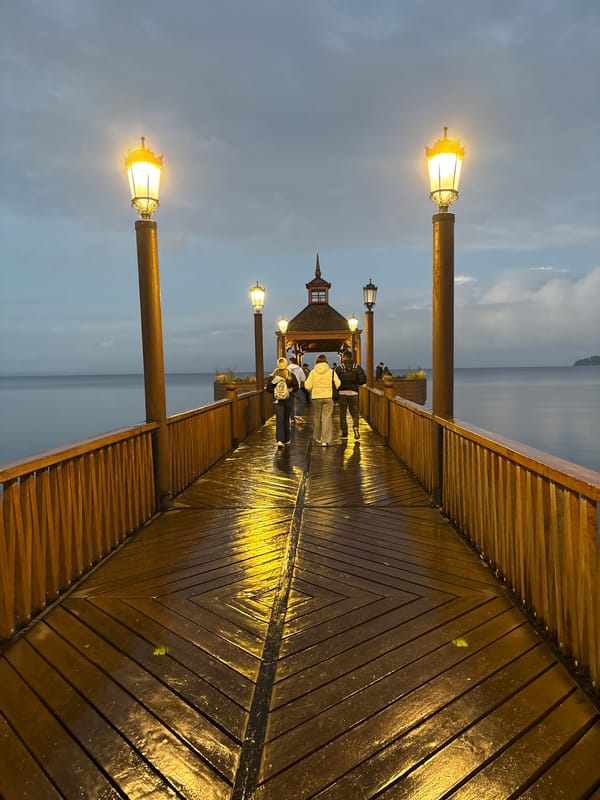 Evening stroll captured on illuminated pier in Frutillar, Chile