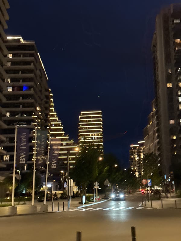 Evening urban life documented across modern Belgrade district