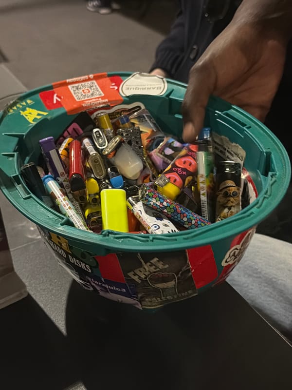 Person holds container filled with lighters in Milan