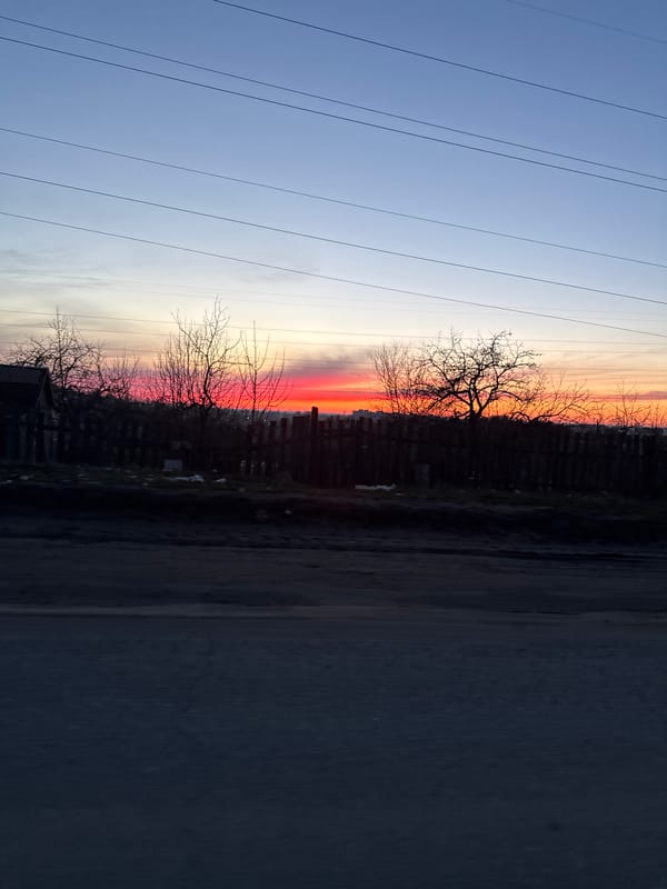 Sunset observed in Chaikovsky, Russia displays orange-blue sky gradients