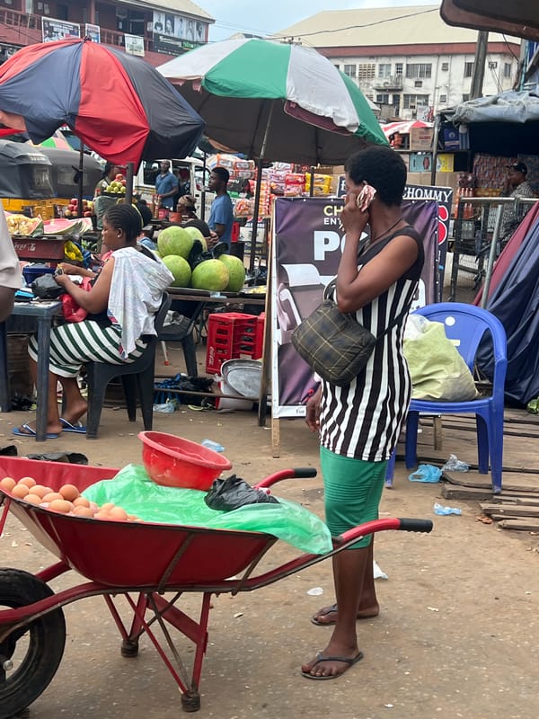 Nkpor street market buzzing with vendors and keke traffic