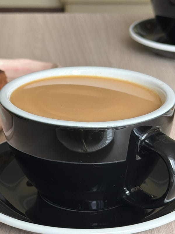 Coffee cup with cream photographed early morning June 1st