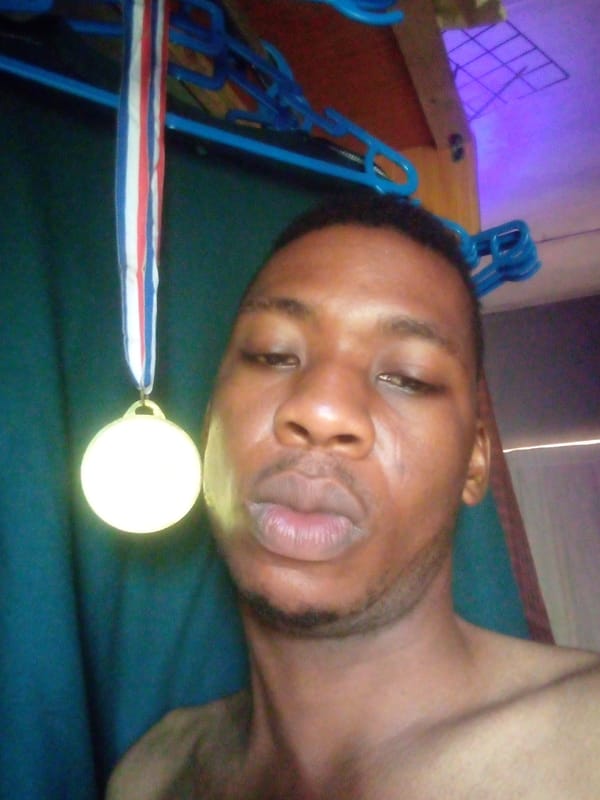 Man takes medal selfies in Ikorodu, Nigeria