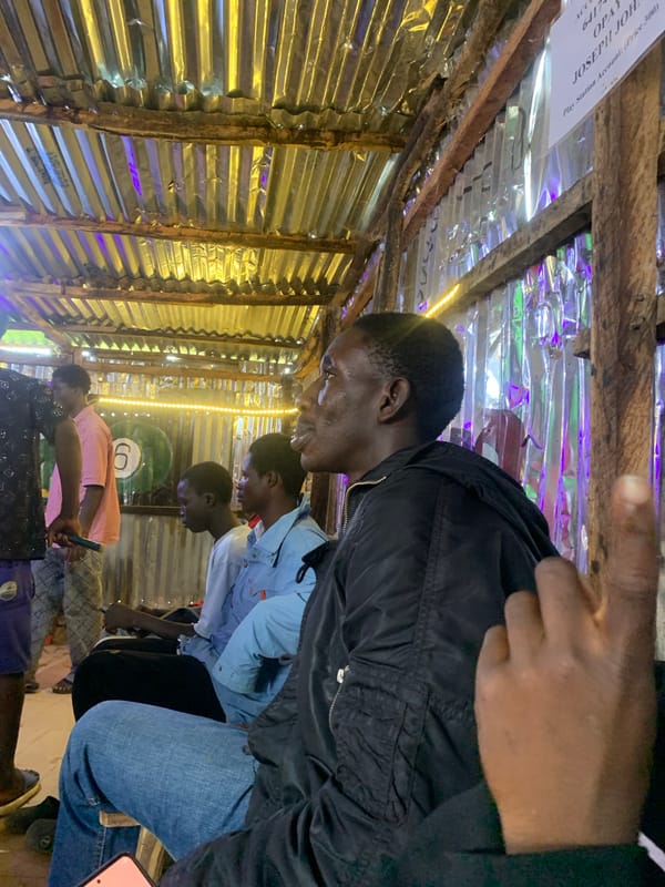 Young men enjoy games at makeshift entertainment center in Nigeria