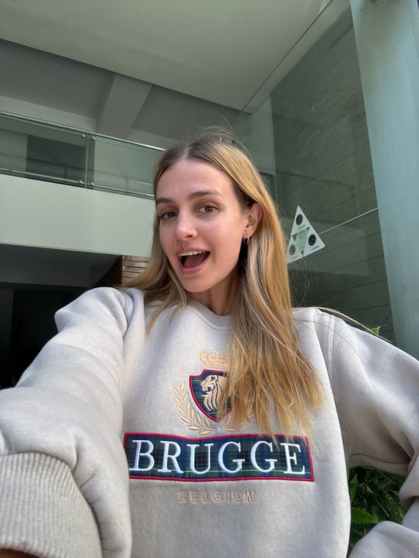 Woman takes selfies, uses tablet in Tbilisi indoor location