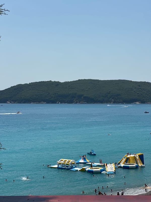 Boreti beach in full summer swing — crowds, parasails, Adriatic views