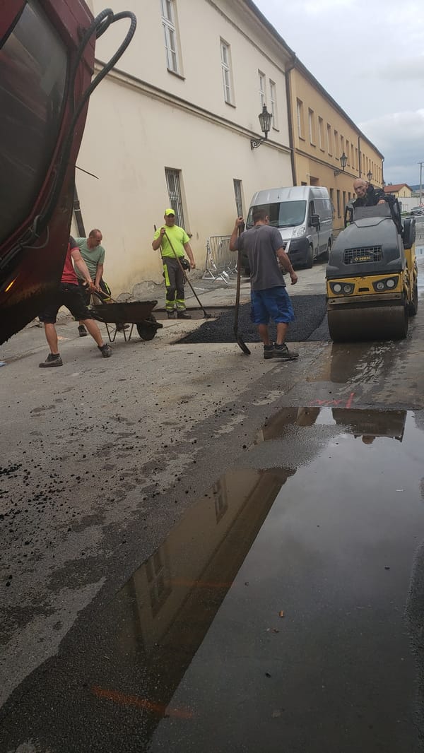 Road crews conduct paving work in Prešov, Slovakia