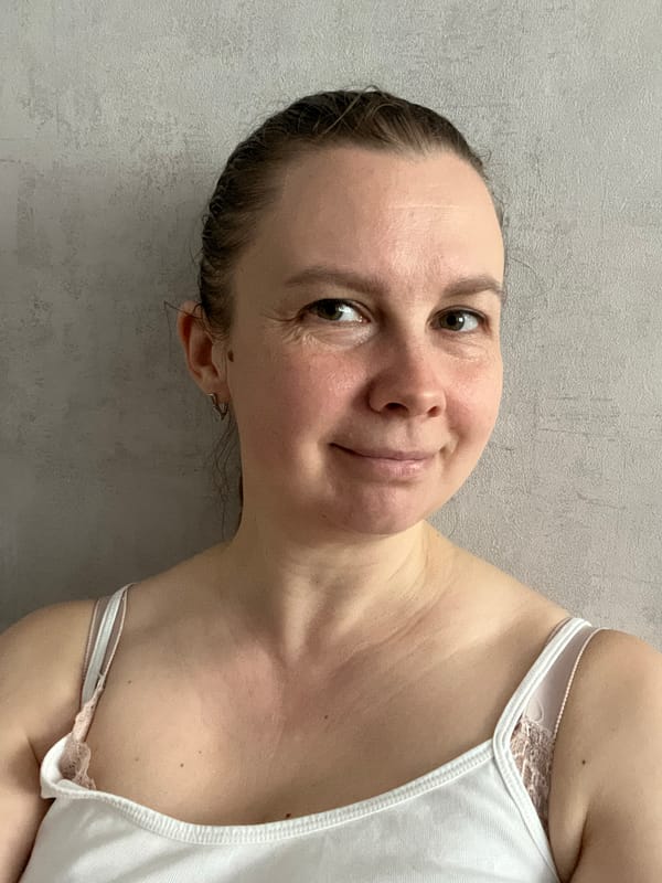 Woman takes selfies during family time in Izhevsk home