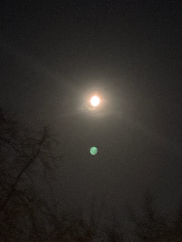 Night sky with moon and second light source observed