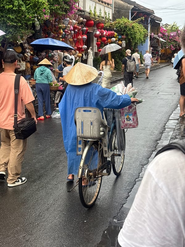 Rainy day street life in Hoi An's Old Town