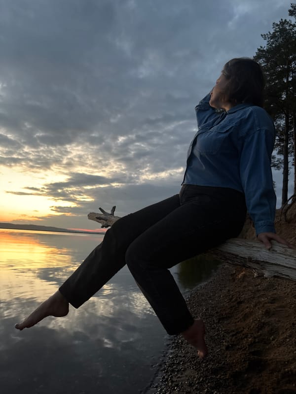 Mother and daughter enjoy sunset waterfront outing with nearby performances