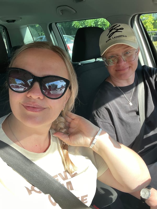 Two women photographed in car during daylight in Vologda