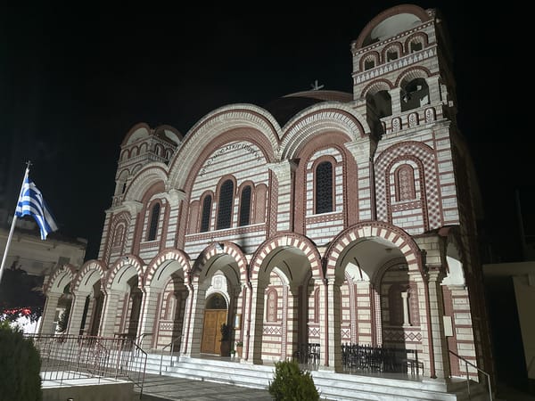 Ornate Orthodox church illuminated at night in Asprovalta, Greece