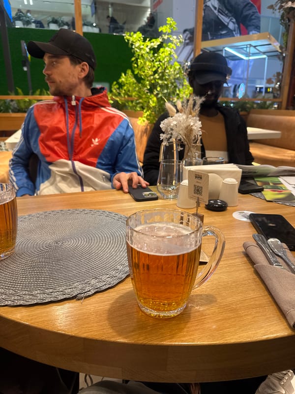 Two people dining at restaurant table observed