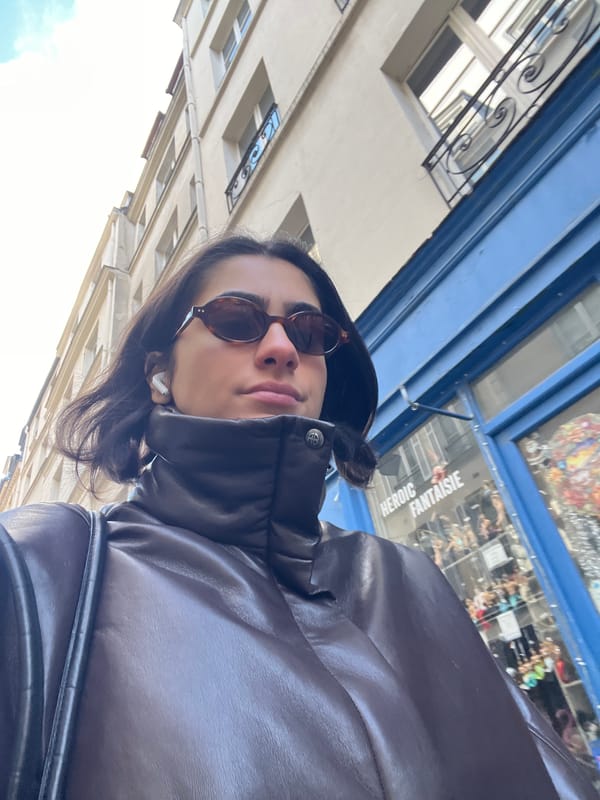 Tourist takes selfies on Paris street