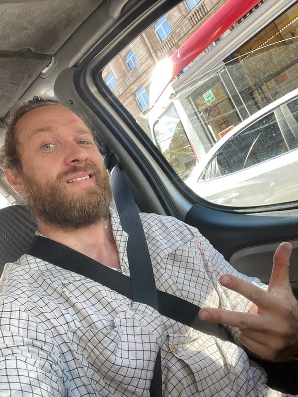 Peace sign from the passenger seat in Saint Petersburg