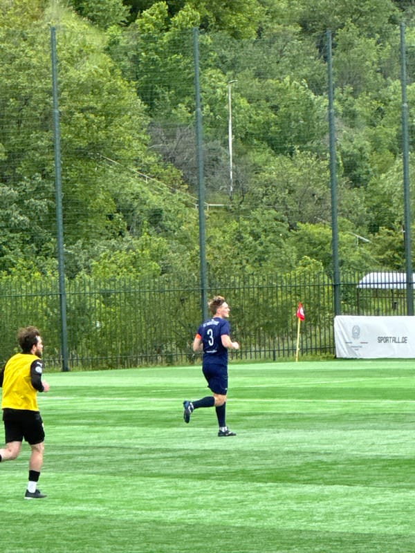 Soccer match observed by spectators in Tbilisi, Georgia