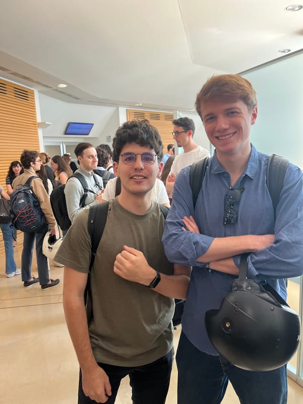 Young men gather in Milan indoor corridor